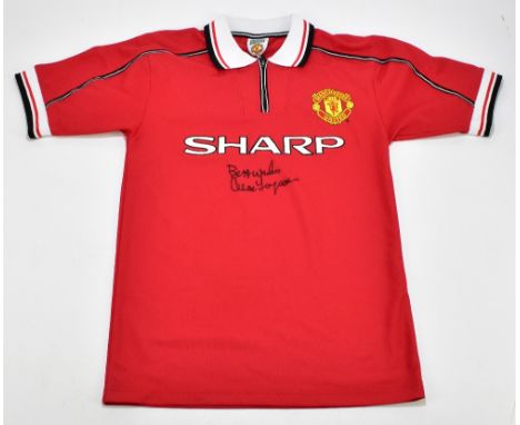 SIR ALEX FERGUSON; a Manchester United home treble shirt, signed to the front and inscribed 'Best Wishes', size S.Additional 