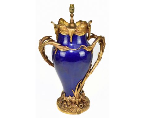 A large dark blue glazed French baluster vase, ormolu mounted as a lamp with pierced scrolling handles and detail throughout,