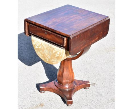 A William IV mahogany work table, with drawer and silks box on octagonal column and platform base, height 74.5cm, depth 54cm.