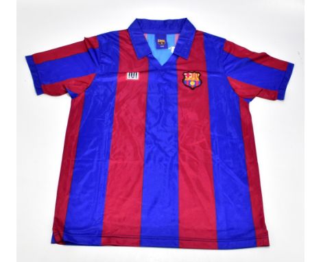 DIEGO MARADONA; a retro style Barcelona home shirt, signed to the reverse, size L.Additional InformationCreasing and light ge