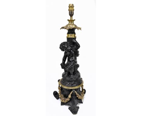 A spelter and brass cherubic figural table lamp on scrolling tripartite base, height including fitment 61cm.Additional Inform