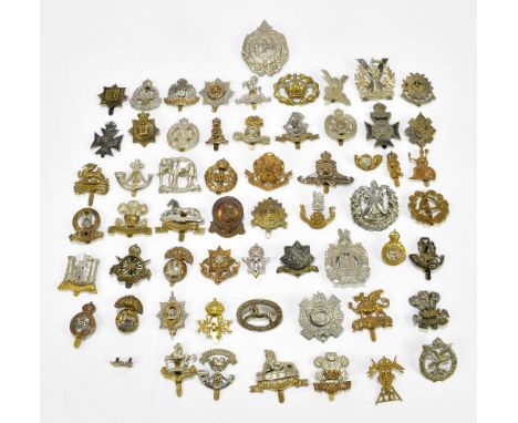 A collection of sixty military cap badges, various regiments including The West Riding, Tyneside Scottish, Army Cyclist Corps