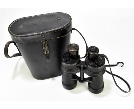 BEH; a pair of German WWII binoculars, the 7x50 binoculars no.464369, the black leather case with embossed imperial eagle abo