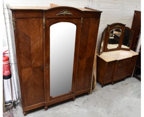 A French Louis XVI style inlaid oak armoire and breakfront dressing table, the dressing table with triple mirror raised back,