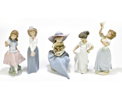 NAO; four assorted figures including a girl holding a bird, height 26cm, also a Lladro figure of a girl holding flowers (5).A