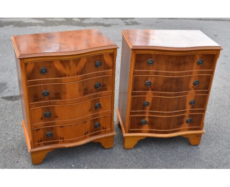 A pair of reproduction yew wood veneered serpentine fronted chest of four drawers, on bracket feet, width 53cm, depth 33cm, h