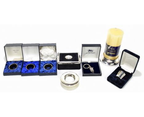 A collection of assorted modern hallmarked silver items including bottle collars, a candle holder, a jewellery casket, a buck