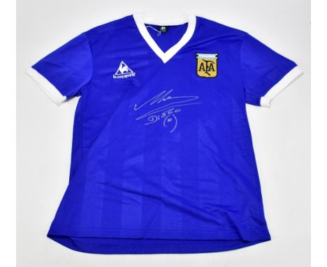 DIEGO MARADONA; a 1986 Argentina 'Hand of God' football shirt, signed to the front, size L.Additional InformationCreasing and