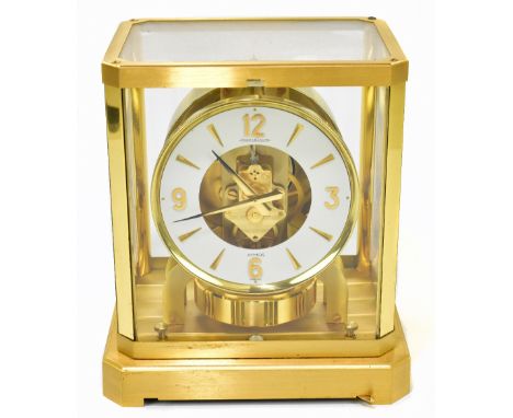 JAEGER LE COULTRE; a gilt metal cased Atmos clock, the circular chapter ring with quarterly Arabic numerals, height 24cm.Addi