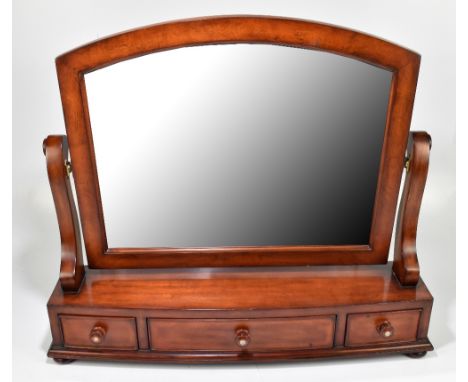 A reproduction mahogany dressing table mirror with three base drawers, the handles inlaid with mother of pearl decoration, wi