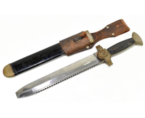 A WWII Third Reich sawback Red Cross Hewer dagger, in scabbard, length of blade 26cm.