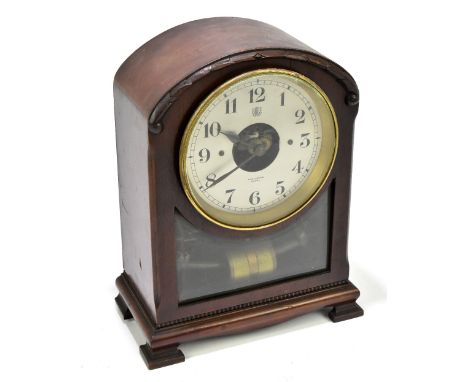 BULLE; an early 20th century mahogany cased electric mantel clock, the silvered dial set with Arabic numerals and signed John