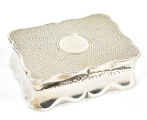 WILLIAM NEALE; an Edward VII hallmarked silver snuff box of shaped rectangular form with engine turned decoration and foliate