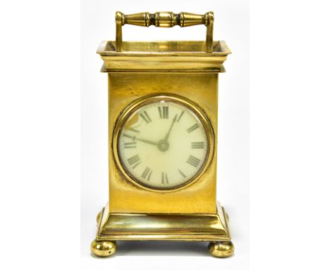 A 19th century brass carriage clock, the enamelled dial set with Roman numerals, on four bun feet, height 13cm.