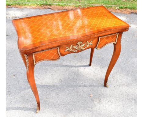 A reproduction Louis XV style serpentine card table, with inlaid top enclosing a baize lined interior, on cabriole legs, heig