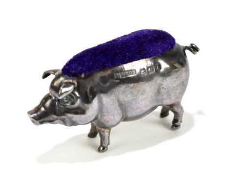 MILLER BROTHERS; an Edward VII hallmarked silver novelty pin cushion in the form of a pig, Birmingham 1906, length 5cm.Additi