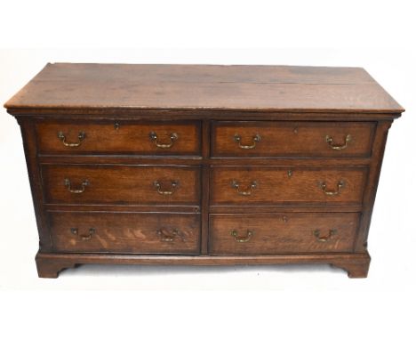 An 18th century oak mule chest, with an arrangement of six drawers on bracket feet, width 151cm, depth 59cm, height 82cm.