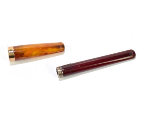 A 9ct gold mounted amber cheroot holder, length 6cm, cased, and a cherry amber cheroot holder with hallmarked silver rim (af)