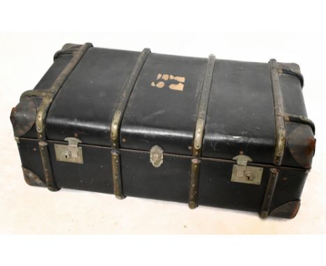 THE NATIONAL CHANNEL; a vintage travelling trunk, length 93cm, with a pair of cast iron andirons (2).