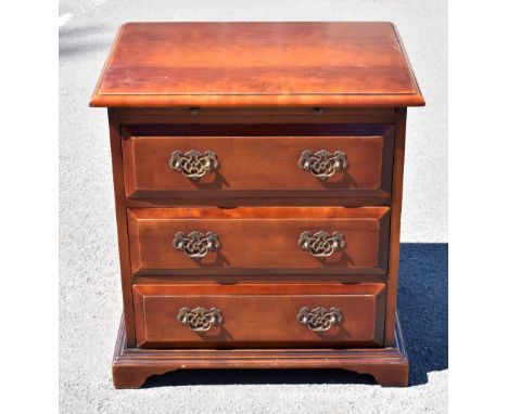 A reproduction mahogany chest of drawers, with slide above three drawers, on bracket feet, height 65cm, width 62cm, depth 46c