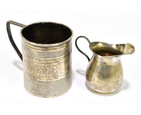 A Georgian hallmarked silver christening mug with chased linear detail in a single band of floral sprays with engraved initia