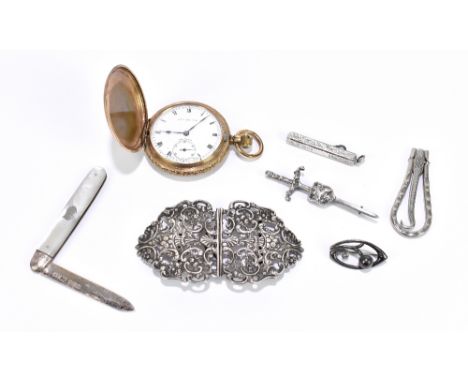 A Victorian hallmarked silver nurse's belt buckle with cast decoration of swags and scrolling detail, Birmingham 1898, a hall