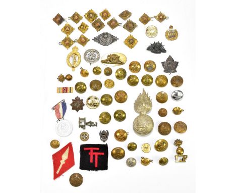 A collection of assorted cap badges, including Lancashire, Royal Corps of Signals, Royal Artillery, Royal Scottish Reserve, a