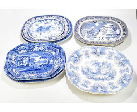 A group of nine blue and white meat plates, all decorated with various patterns.