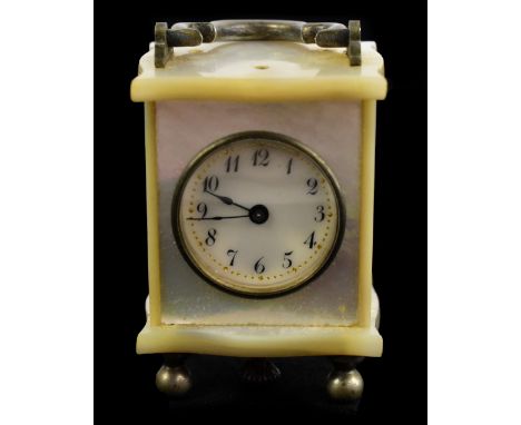 A cased miniature mother of pearl carriage clock, the circular white dial set with Roman numerals, height 4cm.