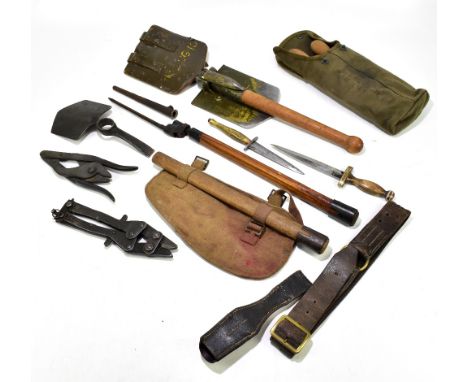 A selection of WWII and later military tools and weapons, including two pairs of wire cutters, two daggers, a chainsaw blade 