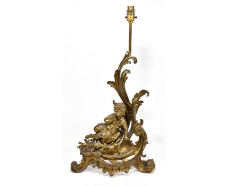 A late 19th century cherubic gilt metal scrolling table lamp, height including fitment 65cm.Additional InformationThis is a c