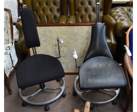 HILLE; two similar office chairs, one with material upholstery, the other with leatherette upholstery, on circular bases (2).