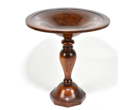 A 19th century stained beech comport, the dished bowl raised on inverted baluster terminating on a octagonal plinth base, hei