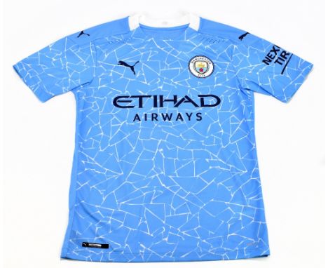 SERGIO AGUERO; a Puma Manchester City home shirt, signed to the reverse, size S.Additional InformationCreasing and light gene