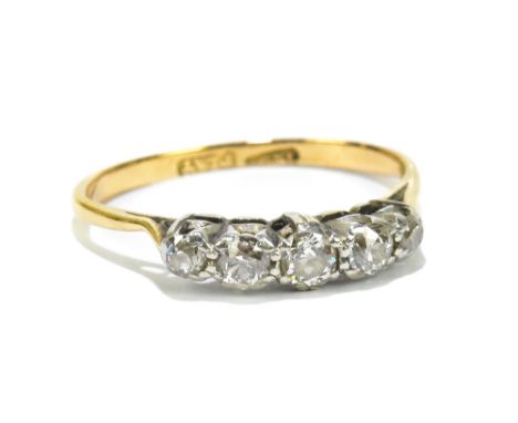 An 18ct yellow gold and platinum tipped five stone graduated diamond ring, the largest stone weighing approx 0.15ct, size M 1