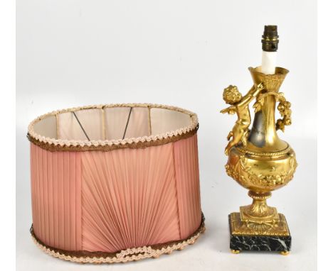 A French Louis XV style gilt metal table lamp, modelled with a cherub, on marble base, height 44cm. 

Additional InformationT