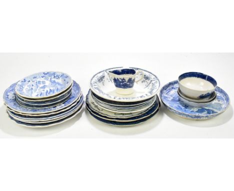 A collection of 19th and 20th century blue and white plates of various patterns, including a pearlware example and a cream ju
