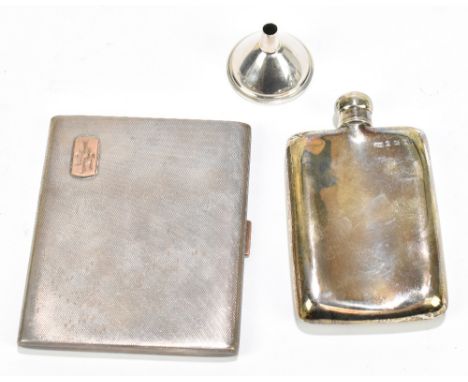 ADIE BROS; a George V hallmarked silver cigarette case of rectangular form with engine turned decoration and yellow metal mou