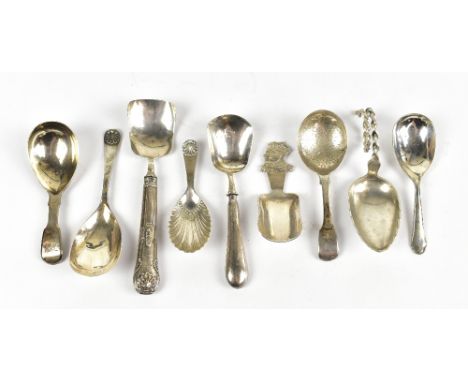 A small collection of hallmarked silver caddy spoons, and two plated examples, weighable silver approx. 3.77ozt/117.4g.