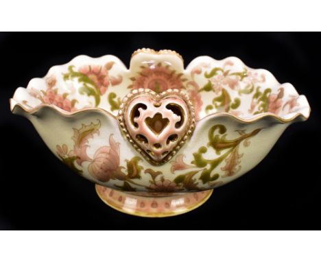 ZSOLNAY PECS; a footed bowl with wavy rim and heart shaped motifs, with painted floral decoration, printed marks and impresse
