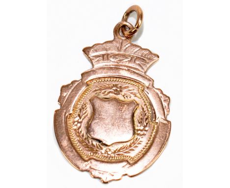 WILLIAM WALTER CASHMORE; a 9ct gold medal with vacant shield shaped cartouche, weight approx. 4.5g.Additional InformationLigh