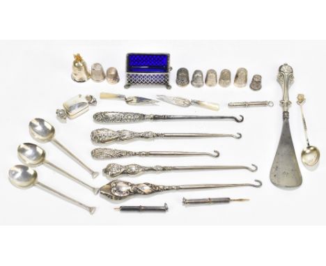 A small collection of assorted silver items including eight thimbles, a modern pill box in the form of a sweet, a rectangular