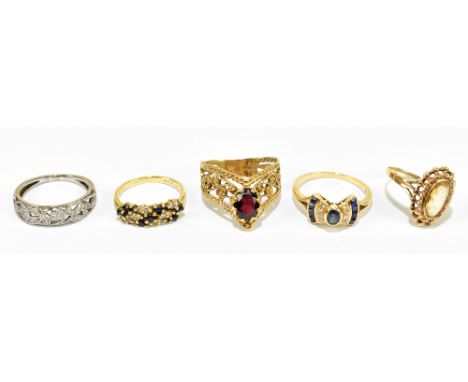 A group of five rings comprising 18ct yellow gold dress ring, size J 1/5, approx. 2.8g, an Art Deco design dress ring stamped