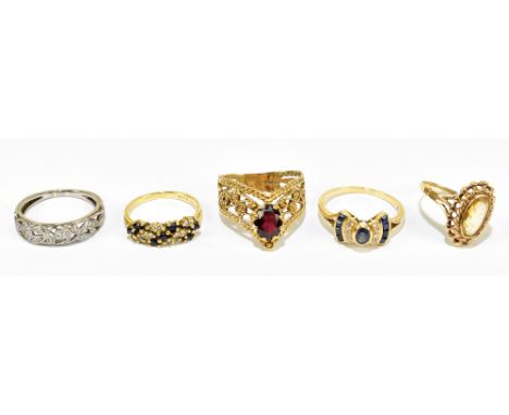 A group of five rings comprising 18ct yellow gold dress ring, size J 1/5, approx. 2.8g, an Art Deco design dress ring stamped