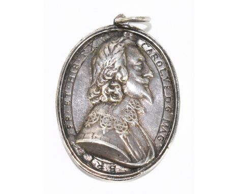 A rare Charles I and Henriette Maria cast silver Royalist badge by Thomas Rawlins, probably made in Oxford circa 1642, with b