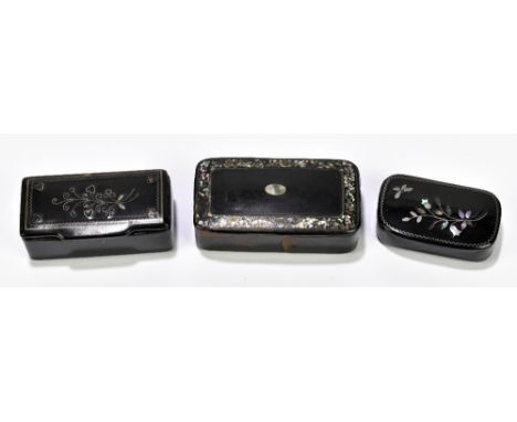 Three Victorian papier-mâché snuff boxes including a rectangular example with white metal inlay, width 6.5cm, another example