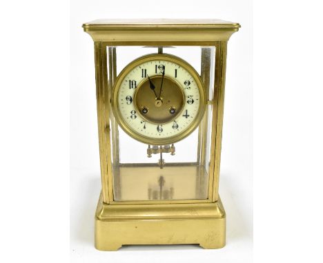 A 19th century brass four glass mantel clock, the applied dial set with Arabic numerals, with mercury pendulum and associated