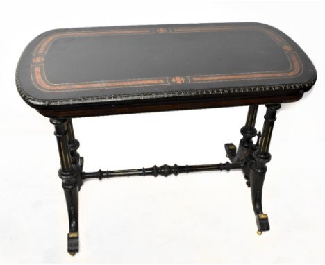 A Victorian ebonised card table, with hinged top on turned column supports and scroll legs, height 72cm, width 98cm, depth 48