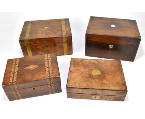 A Victorian rosewood vanity box with inlaid mother of pearl shield shaped cartouche, the hinged cover enclosing part fitted i