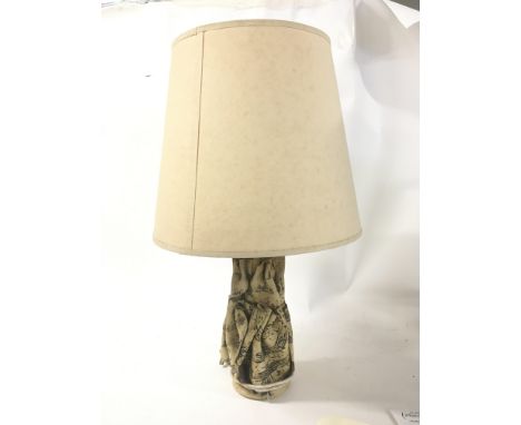 A Contemporary ceramic lamp in the form folded music sheets by Bernard Rooke Hight 60cm including shade.